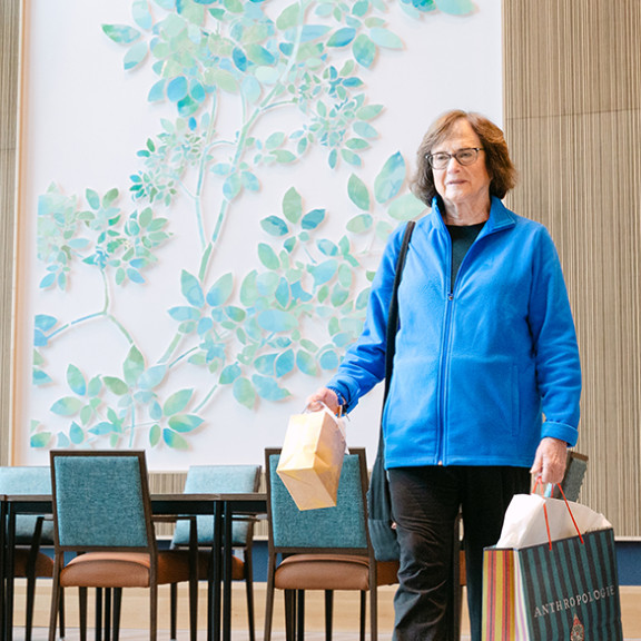 Women walking through Opus Newton