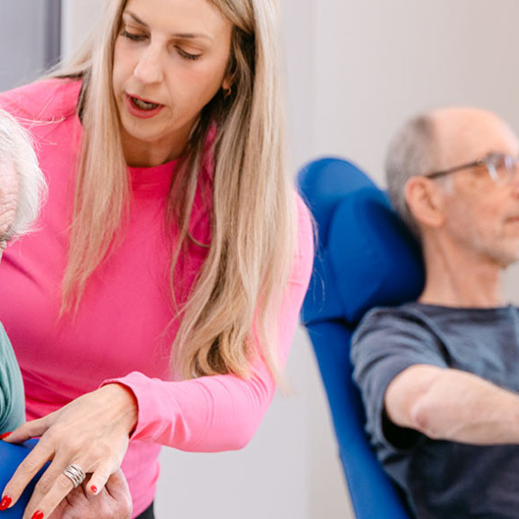 Instructor working with residents at Opus