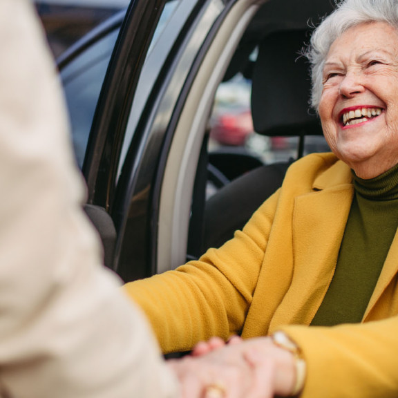 Woman getting out of car