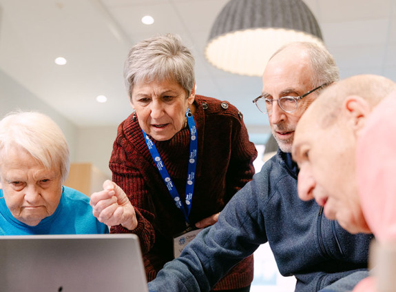 Opus residents around computer