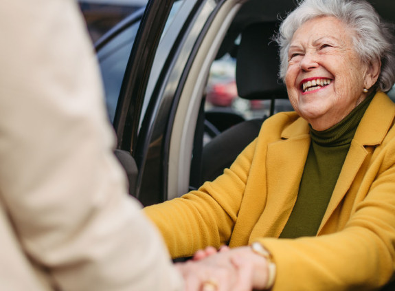 Woman getting out of car