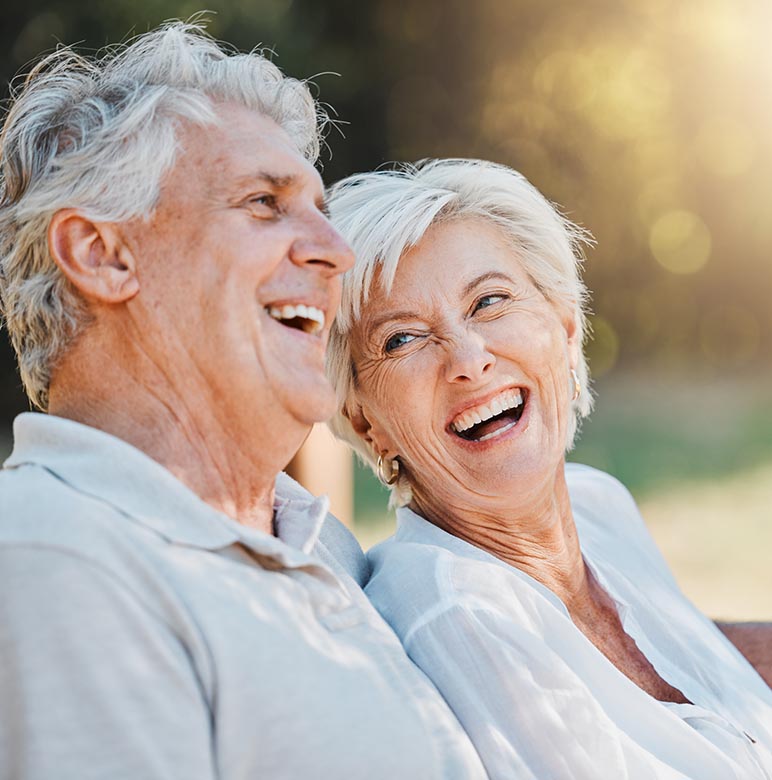 a smiling elderly couple